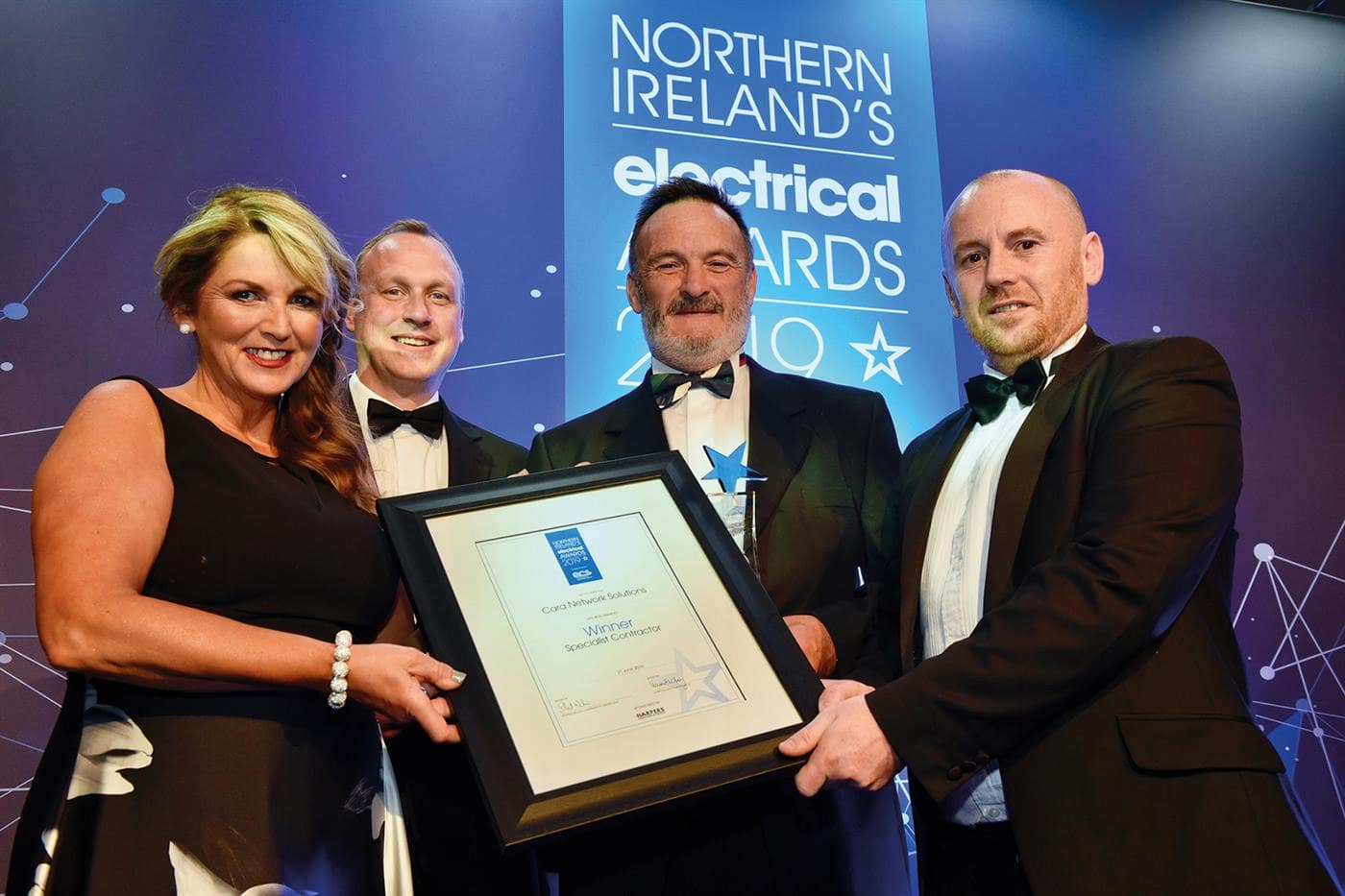 Cara Network Solutions team receiving Specialist Contractor of the Year award